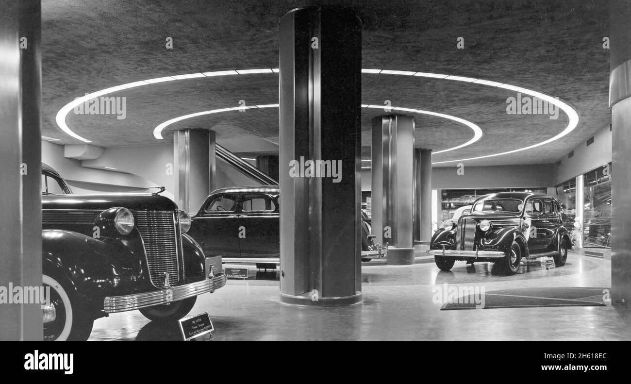 Automobiles in a showroom, these include (L to R) DeSoto, Chrysler, and an Edsel ca. 1936 Stock Photo