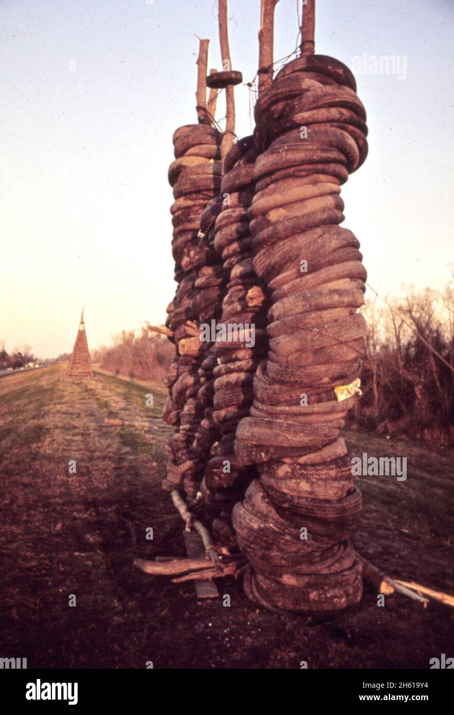 A huge stock of rubber tires awaits burning at the Christmas Eve bonfire along the Mississippi River in Louisiana ca. 1972 Stock Photo
