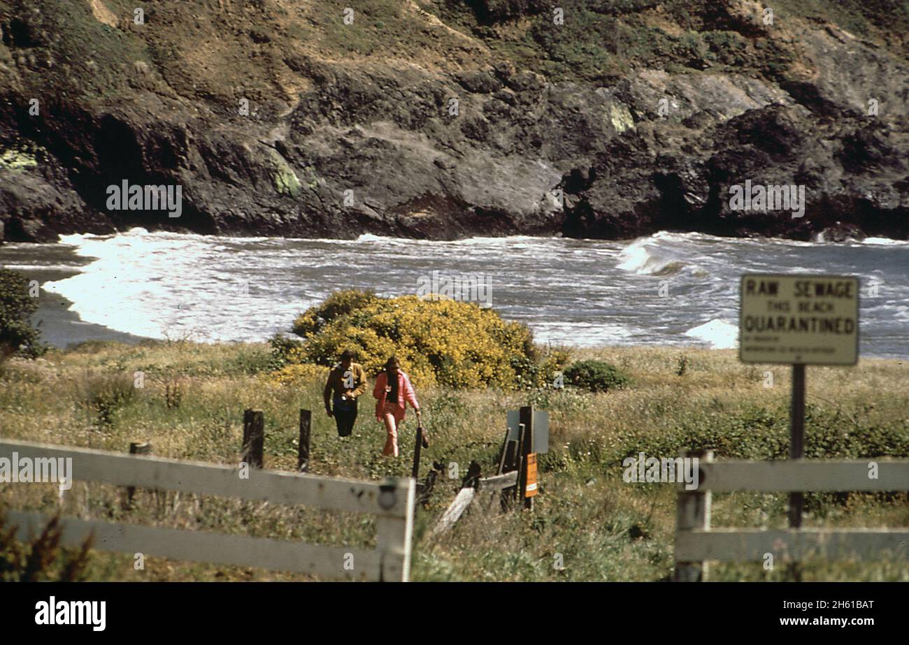 1970s America: Mendocino Beach has passed a sewage treatment plant bond issue after many years of dumping raw sewage on the beach ca. 1972 Stock Photo