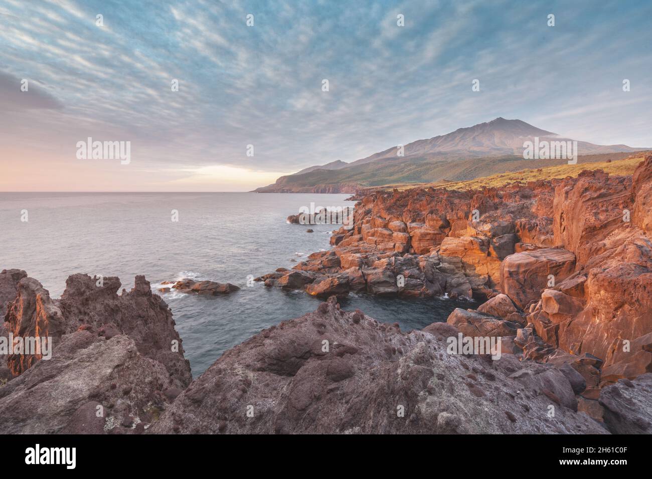 Russia, the Kuril Islands, Iturup Island, sunset near the Yankito lava plateau on the Pacific coast. Stock Photo