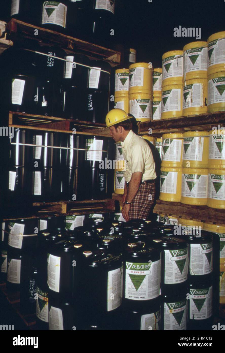 Environmental protection agency pesticides inspector checks labels on