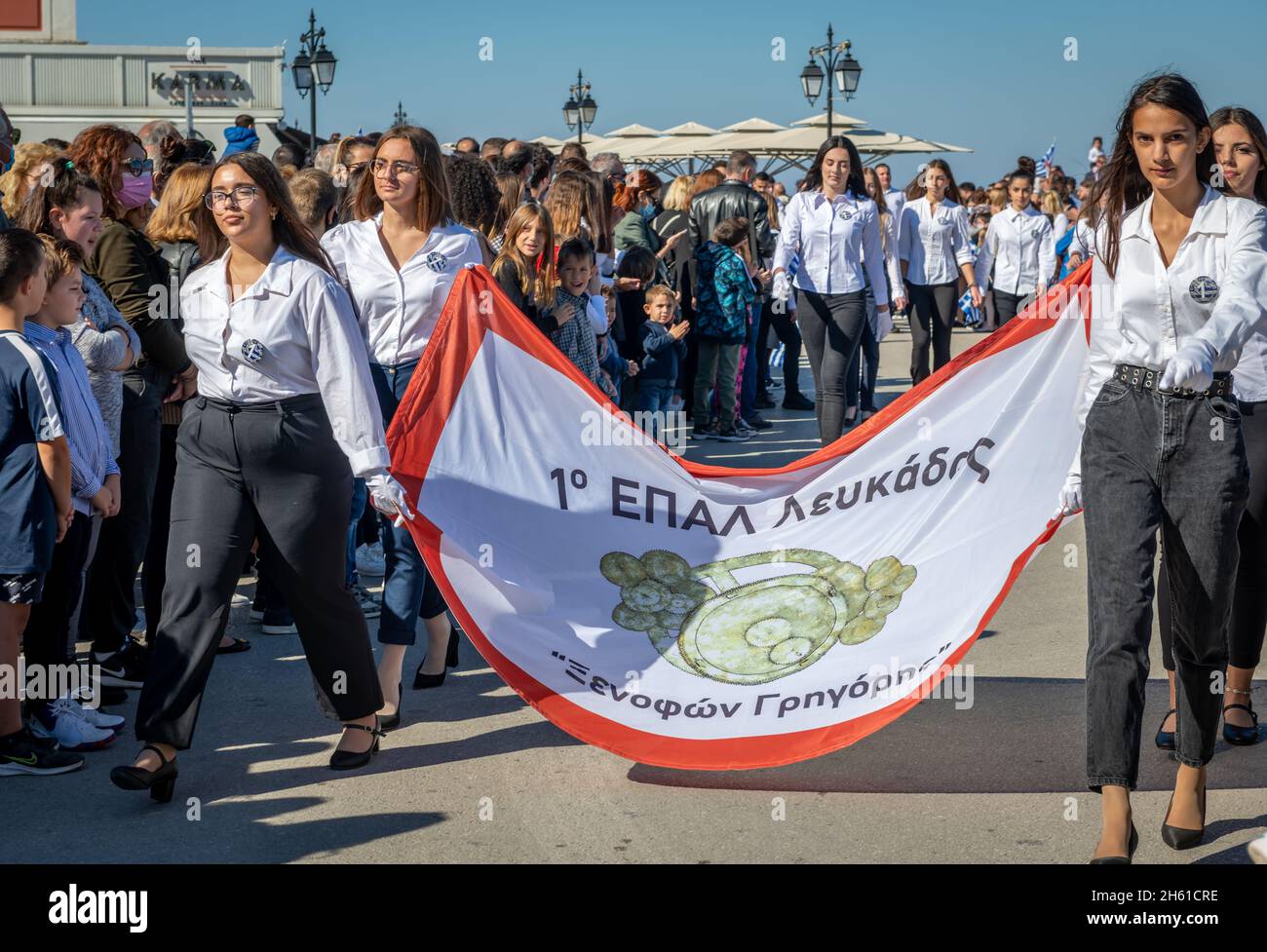 Lefkada. Greece. 10.28.2021. School children marching on the Greek Oxi Day anniversary celebration parade. Stock Photo