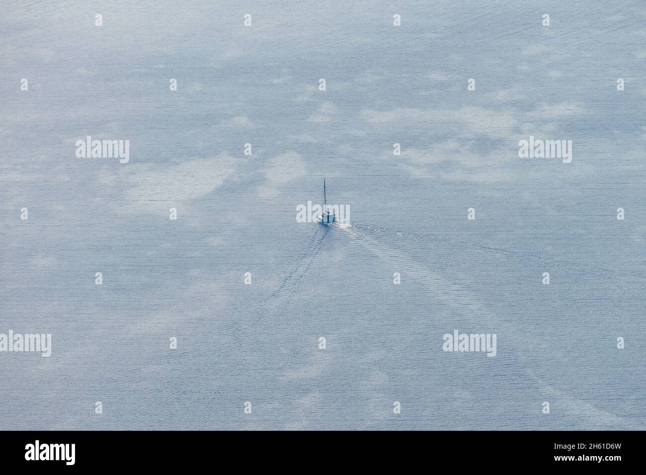 Aerial view of a sailing boat in the wide open sea Stock Photo - Alamy