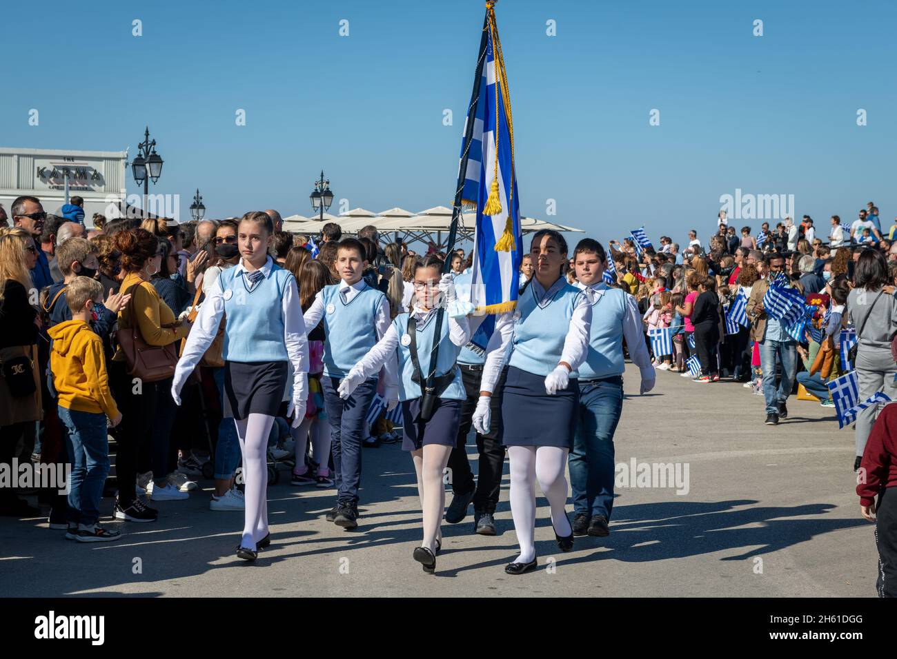 Lefkada. Greece. 10.28.2021. School children marching on the Greek Oxi Day anniversary celebration parade. Stock Photo