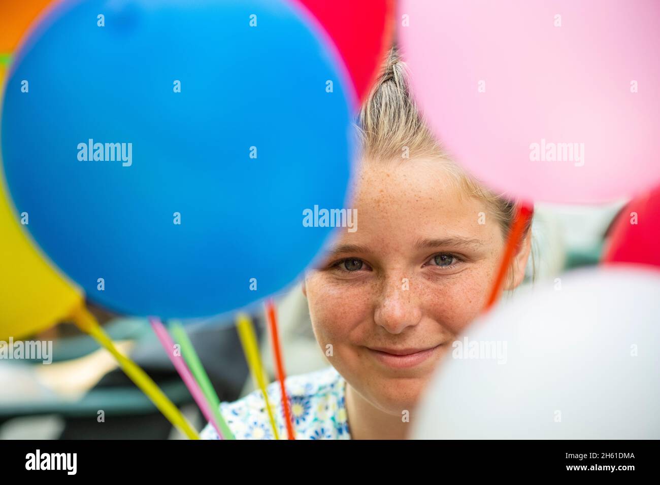 Visitor with balloons at the summer camp on Gravestock's 50th anniversary, Wanup, Ontario, Canada Stock Photo