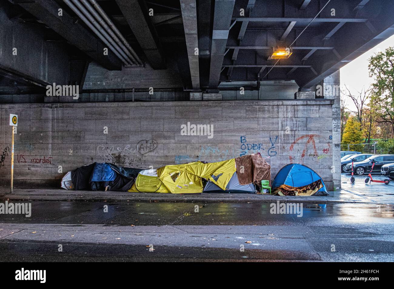 Campsite and tents of Homeless people under raiway bridge in Hertzallee, Charlottenburg,Berlin Stock Photo