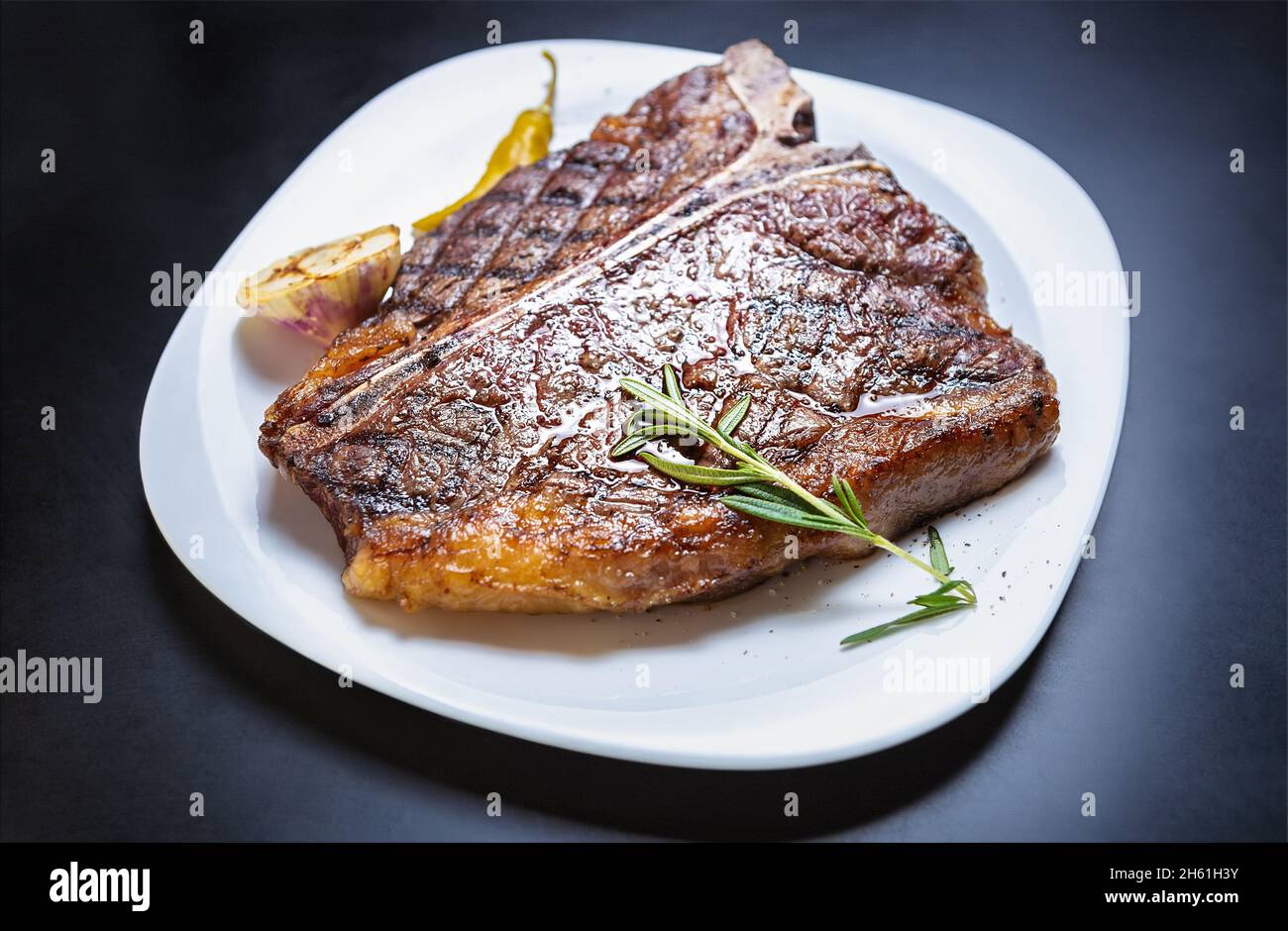 Delicious tbone steak meat cooked on grill for dinner in American restaurant. Gourmet beefsteak