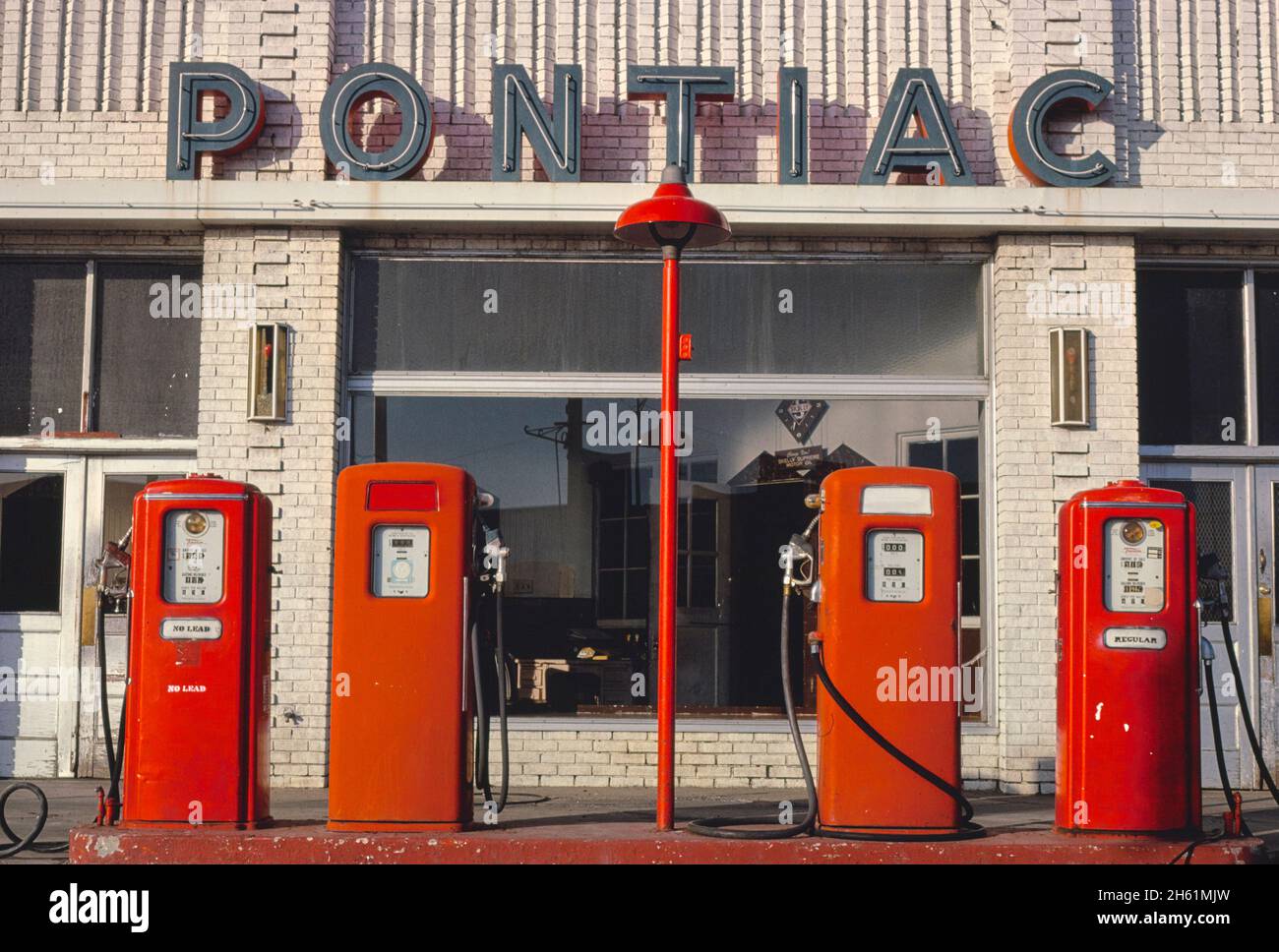 Four gas pumps, Weld County Garage, Rt 85, Greeley, Colorado; ca. 1980