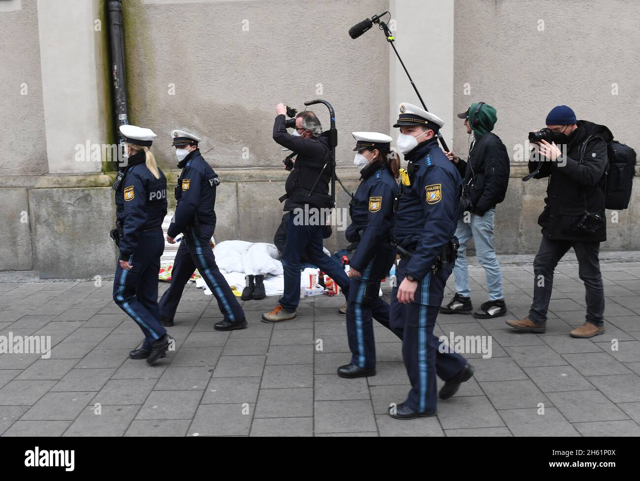 Munich, Germany. 12th Nov, 2021. Police officers (in front) are accompanied by journalists during a press event on Corona controls in Munich. During the controls of the tightened Corona regulations, the police in Bavaria discovered quite a few violations. Credit: Felix Hörhager/dpa/Alamy Live News Stock Photo