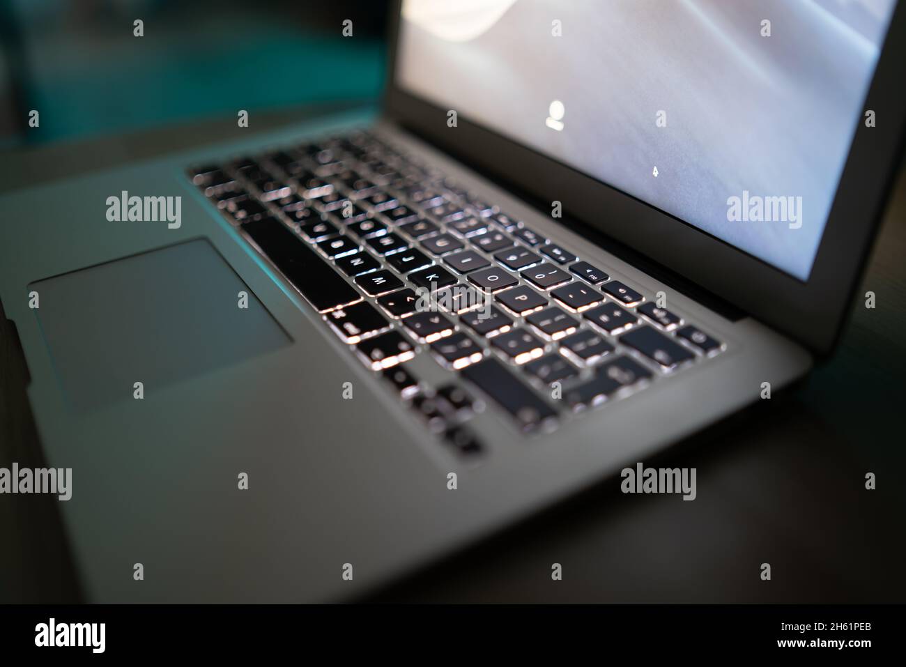 Close up of laptop keyboard colorful neon illumination, backlit keyboard. Stock Photo