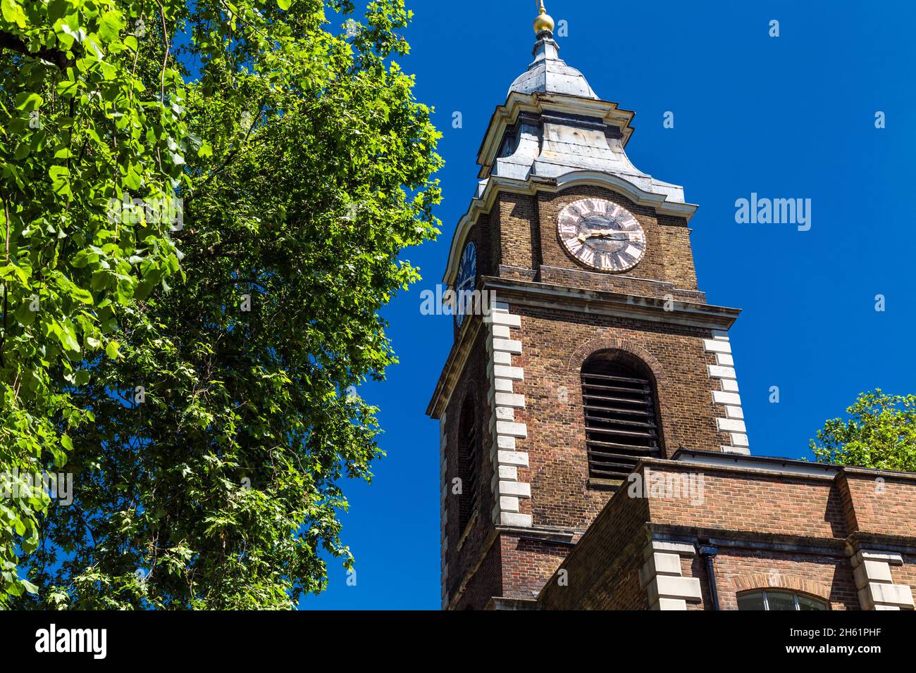 Clock tower of St Johns Court, converted remains of the St John the Evangelist Church, Scandrett Street, Wapping, London, UK Stock Photo