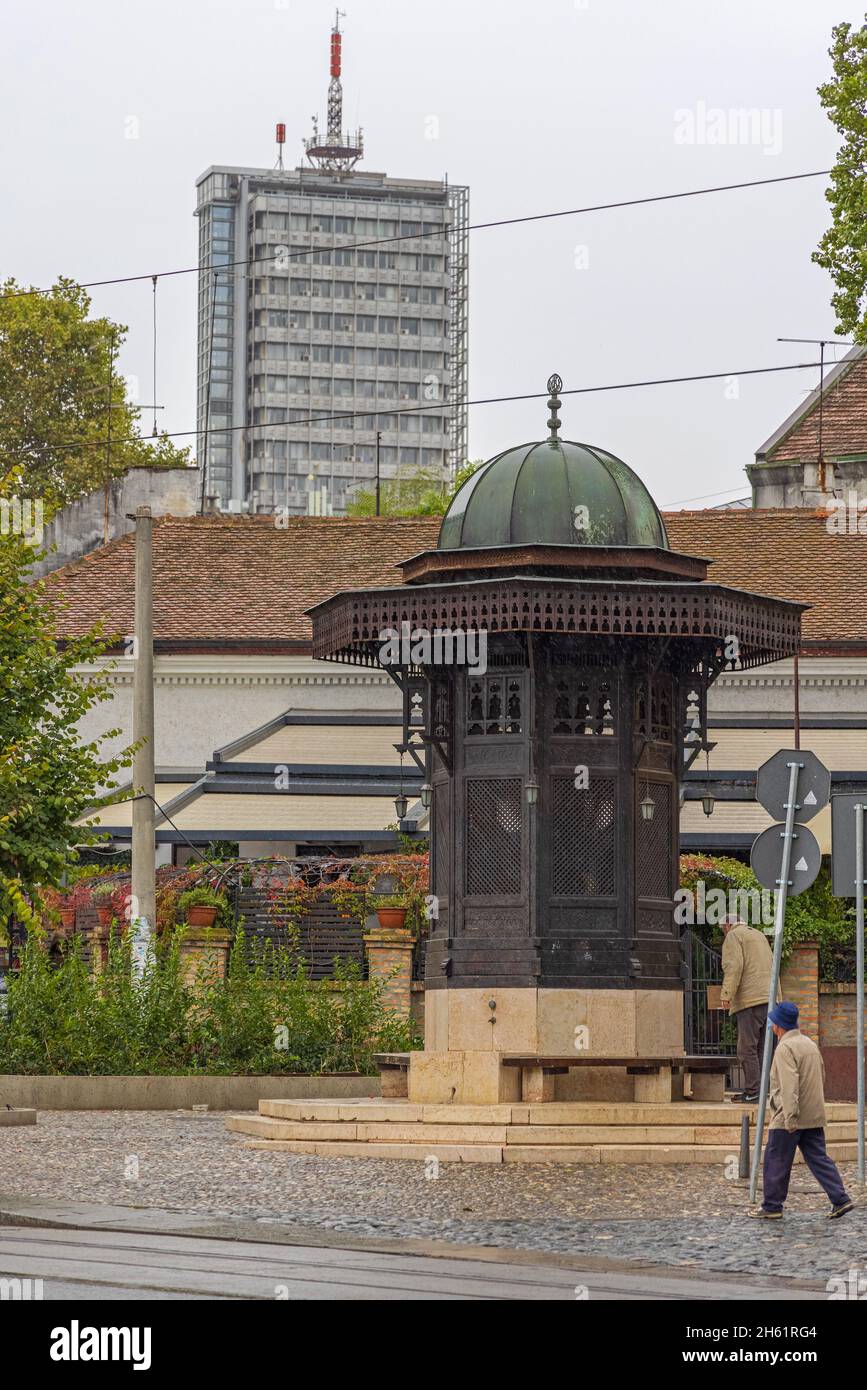Belgrade, Serbia - October 07, 2021: Turkish Fountain Sebilj Skadarlija and Politika Skyscraper Autumn Day. Stock Photo