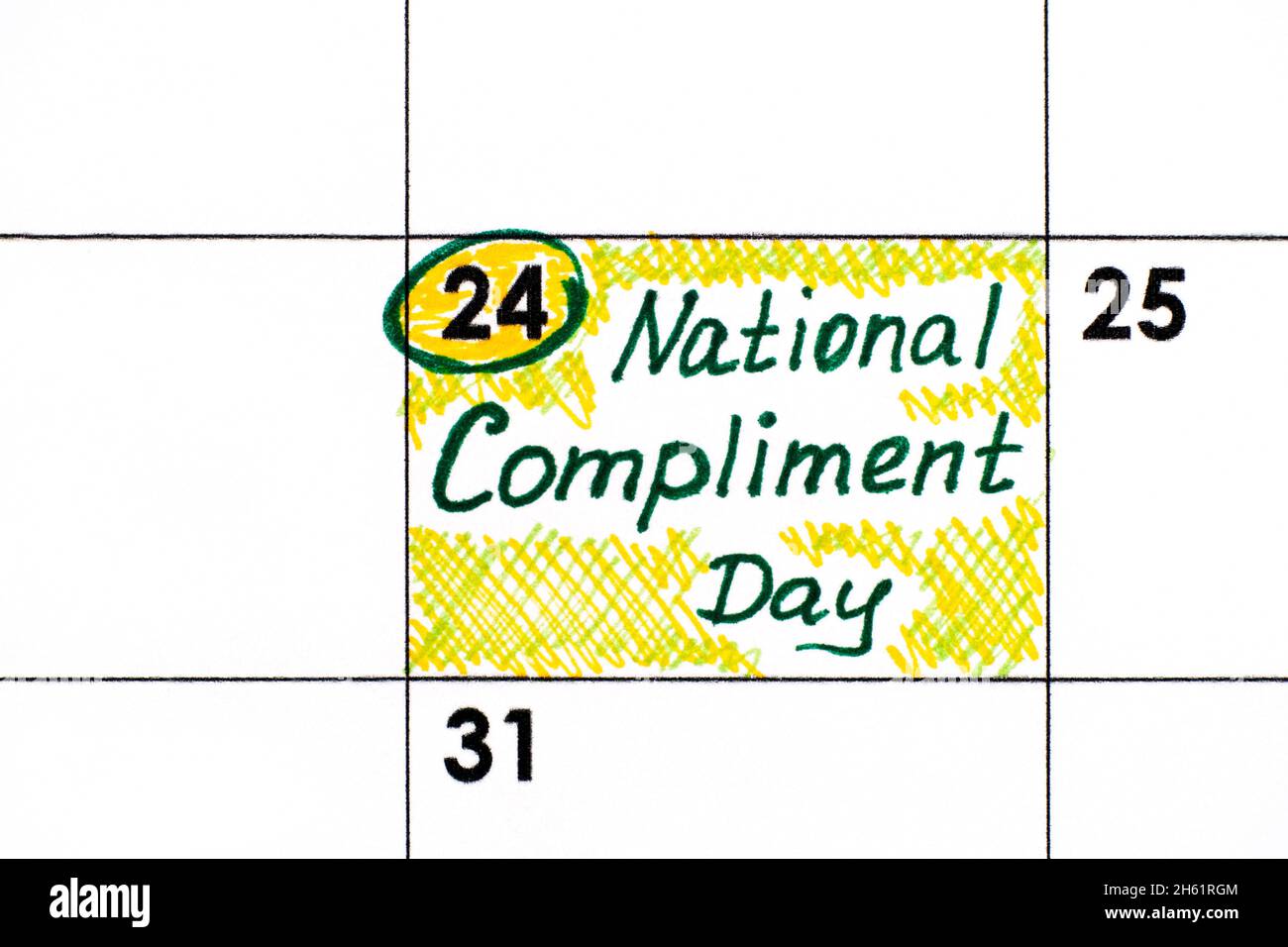 Handwriting reminder National Compliment Day in calendar. January 24 Stock Photo