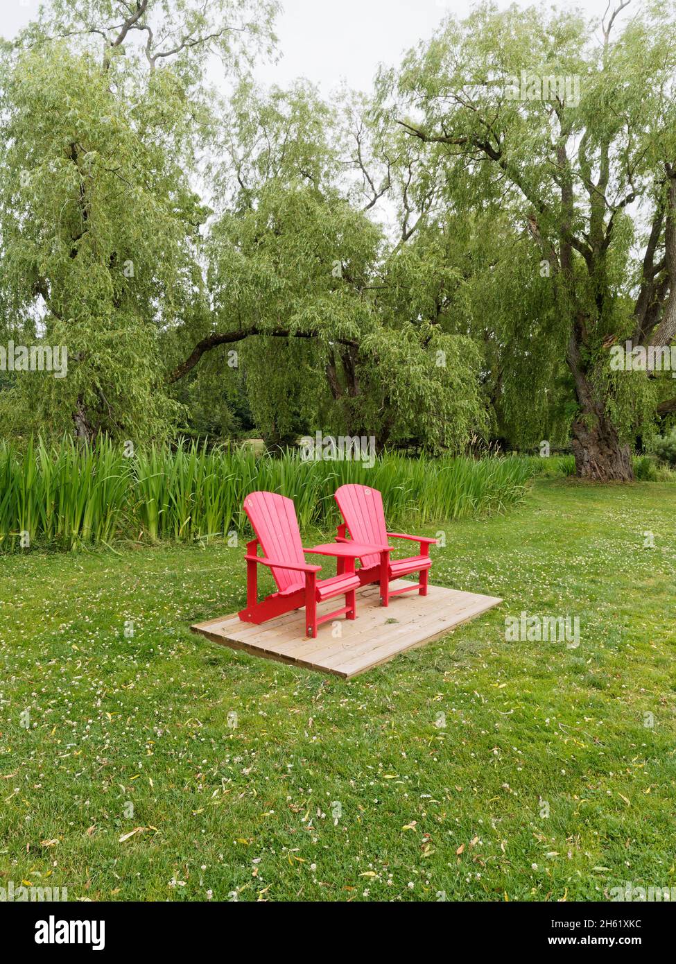 canada,grand-pré,grounds of memorial to acadian deportation,historic site,no photo release needed for tourism,no property release needed for tourism promotion,nova scotia,parks canada,parks canada red chairs Stock Photo