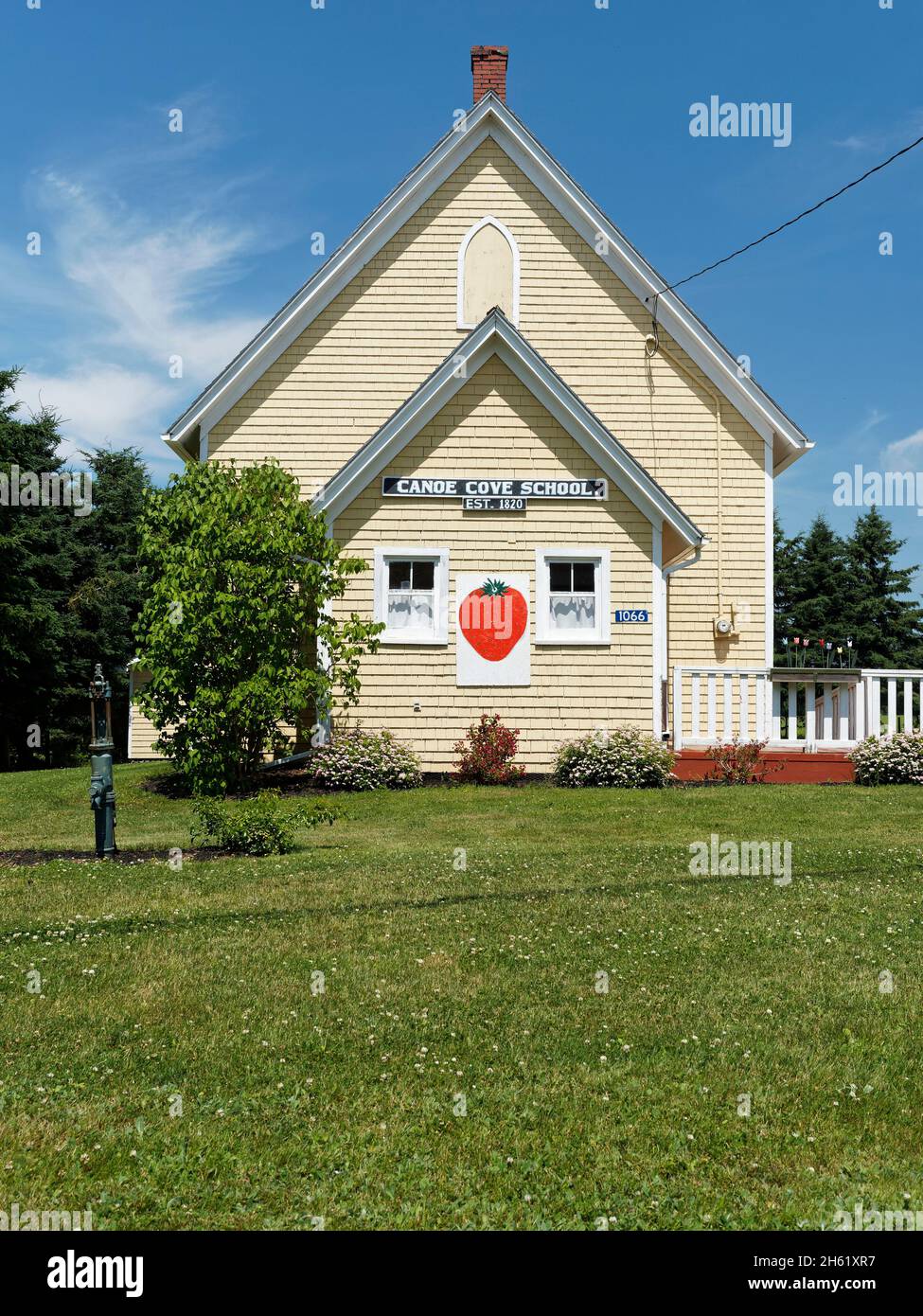 'down east',a village church,canada,community of grand- pré,prince edward island,strawberry festival banner Stock Photo