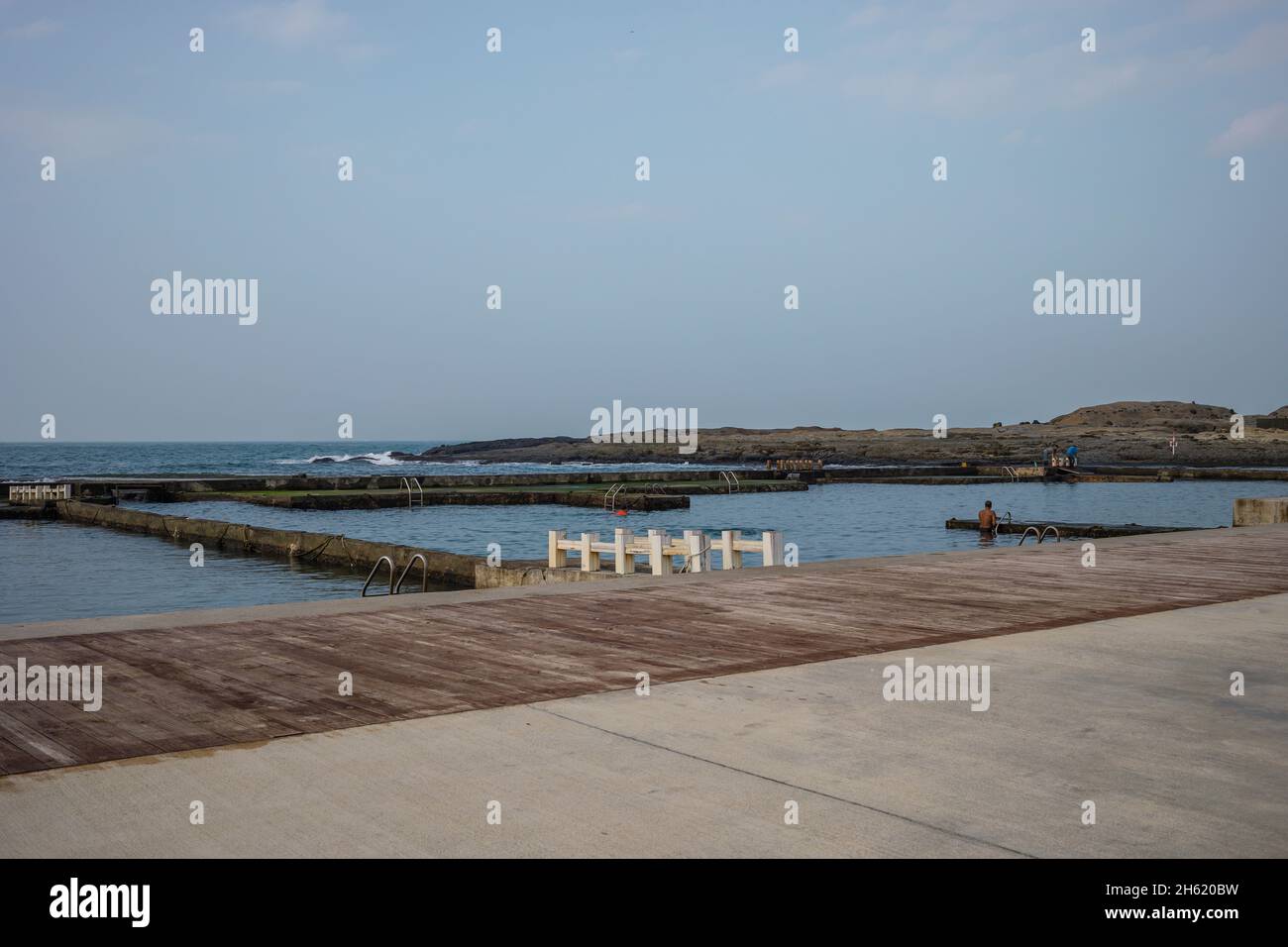 outdoor sea swimming pool in heping island park with cliff Stock Photo