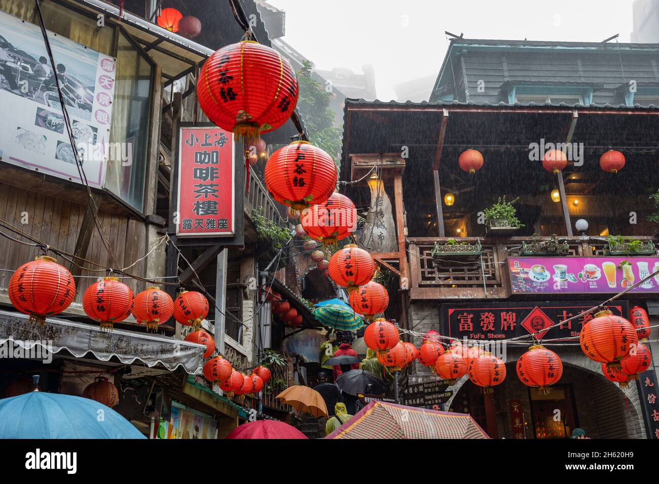 rain and chinese lanterns in jiufen old street,historic mountain