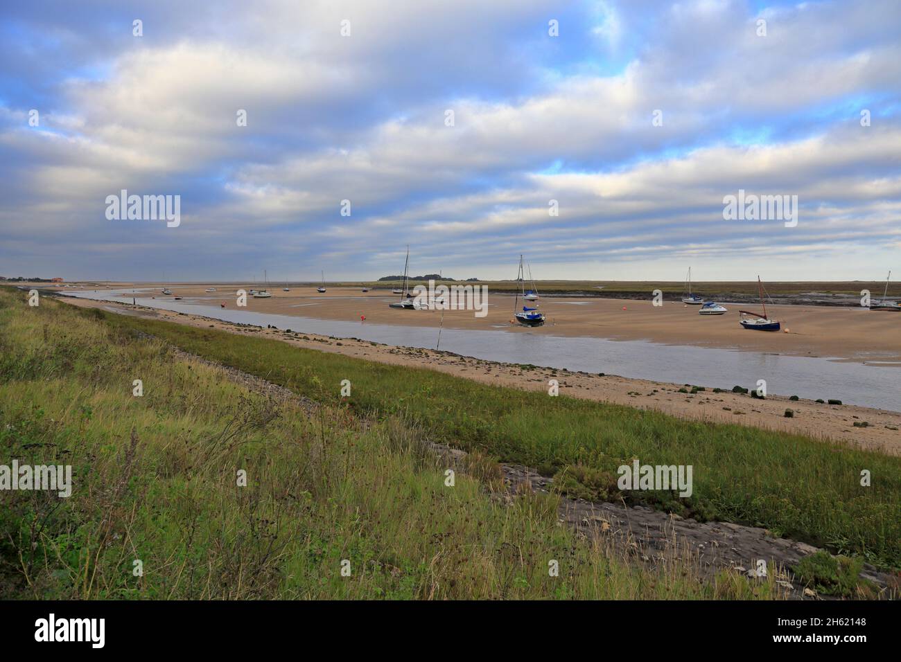 Mudflats and salt marshes from the Peddars Way Trail at low tide in Wells-next-the-Sea, Norfolk, England, UK. Stock Photo