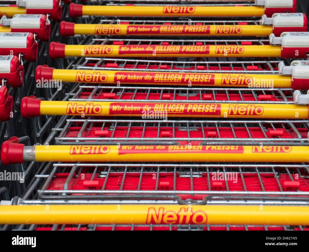 branch of the netto company in schwabmünchen with stacked shopping trolleys Stock Photo
