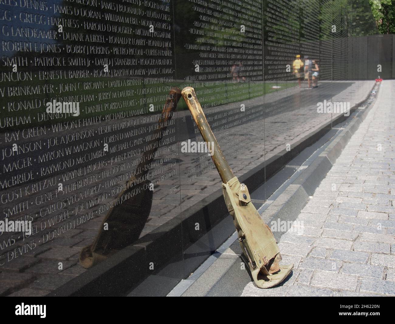 Weapon left in tribute to a soldier listed on  the Vietnam Memorial Wall, Washington, D.C., USA, 2021 © Katharine Andriotis Stock Photo