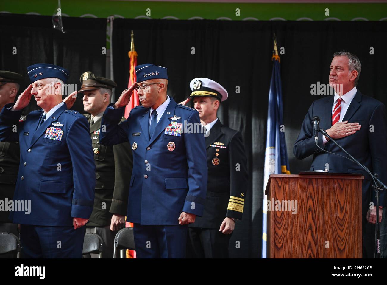 New York City, United States of America. 11 November, 2021. U.S. Air Force Chief of Staff Gen. CQ Brown, Jr., center, joins Mayor Bill de Blasio in a salute during the 102nd Annual Veteran's Day Parade, November 11, 2021 in New York City, New York. Credit: TSgt. Ryan Conroy/USCG Photo/Alamy Live News Stock Photo