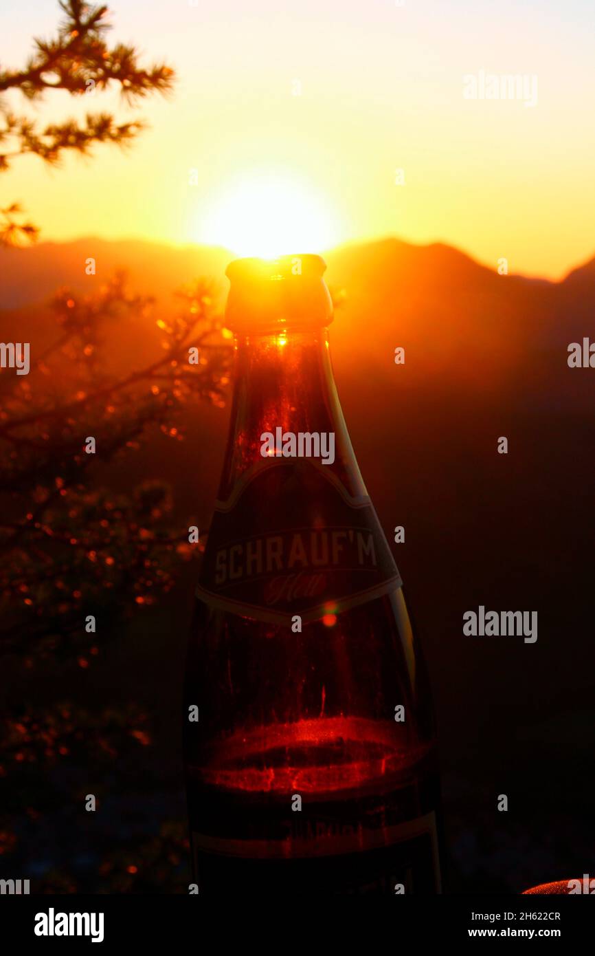 Bottle beer in the backlight of the setting sun hires stock photography and images Alamy