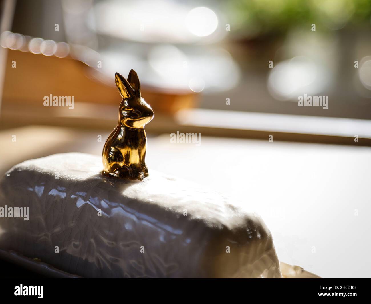butter dish with a golden hare Stock Photo