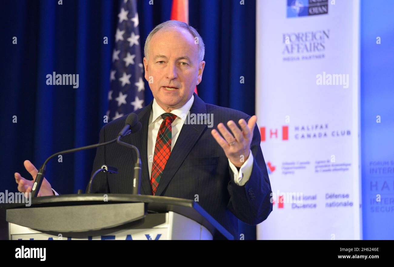 Canada's Minister of National Defense Rob Nicholson speaks to reporters during a press conference after he and Secretary of Defense Chuck Hagel  signed a memorandum of understanding titled 'Cooperation Framework' at the Halifax International Security Forum in Halifax, Canada, Nov. 22, 2013. Stock Photo