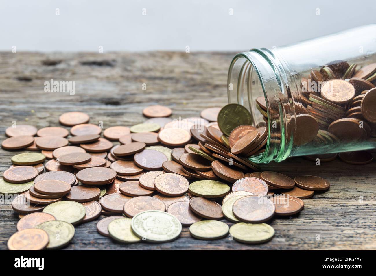 Save money and account banking for finance concept, Hand with coin on blurred background Stock Photo