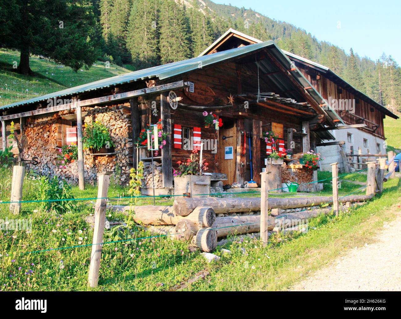 austria,tyrol,way,hut,lafatscher-niederleger,wooden hut,building,footpath,hike,alpine pasture,sunset Stock Photo
