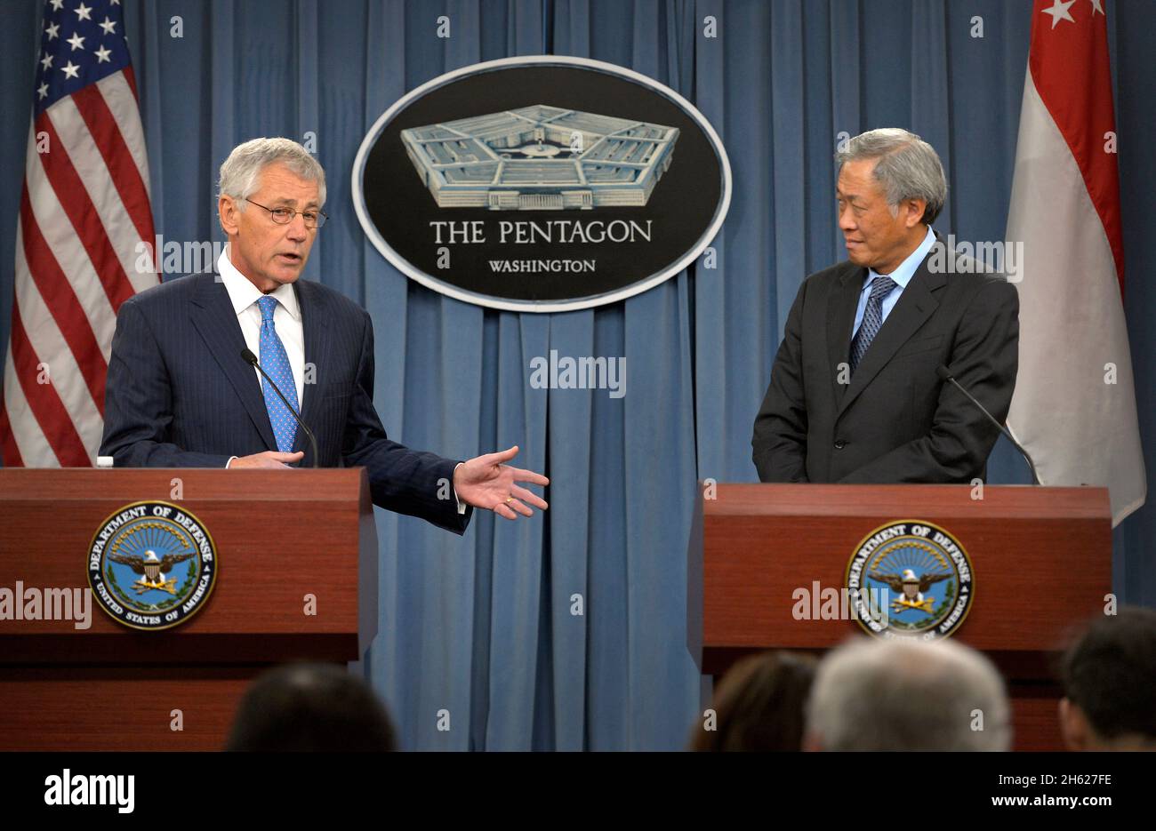 Secretary of Defense Chuck Hagel, left, and Singapore Minister of Defense Ng Eng Hen hold a press conference at the Pentagon in Arlington, Va., Dec. 12, 2013. Stock Photo