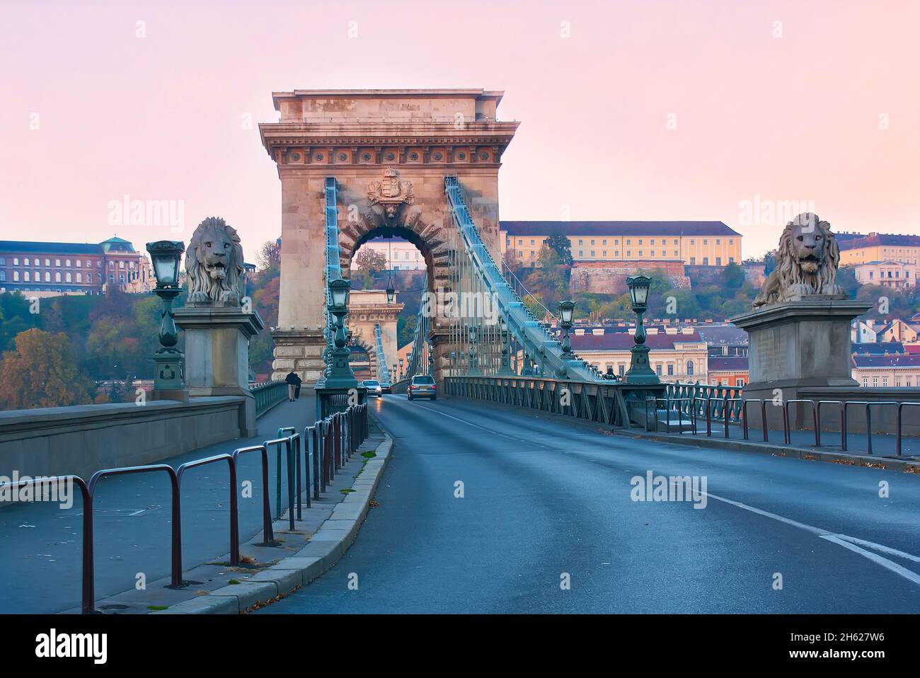 The scenic stone Chain Bridge is decorated with stone lions and ...
