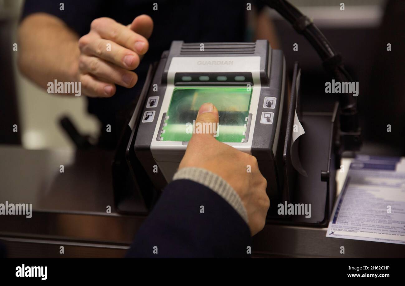 U.S. Customs and Border Protection officers screen international ...