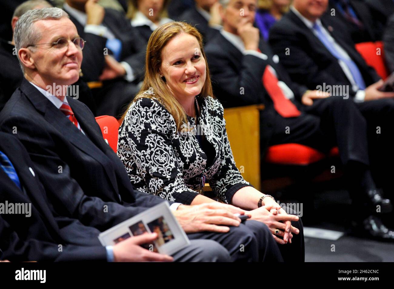 Michele Flournoy, undersecretary of defense for policy, smiles as Secretary of Defense Leon E. Panetta thanks her for her service during a farewell ceremony held in her honor in the Pentagon Auditorium Monday, January 30, 2012. Also in attendance is Deputy Secretary of Defense Ashton B. Carter. Stock Photo