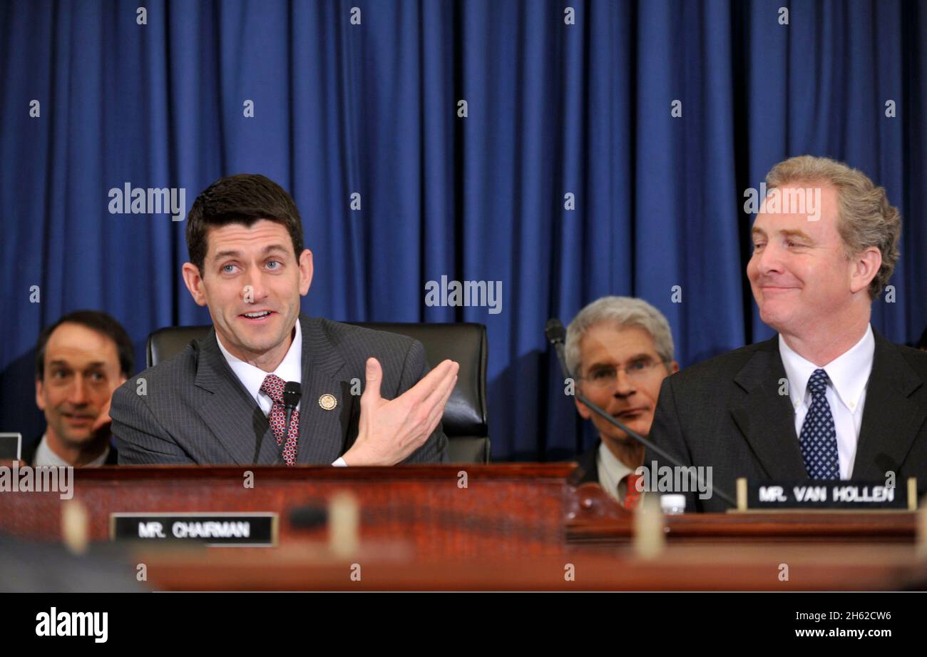 U.S. Rep. Paul Ryan of Wisconsin gestures toward a painting on the chamber walls, reminding Secretary of Defense Leon E. Panetta, not shown, of his past historic term as a chairman of the House budget committee, during a hearing on the fiscal 2013 National Defense Authorization budget request Feb. 29, 2012, in Washington, D.C. Stock Photo