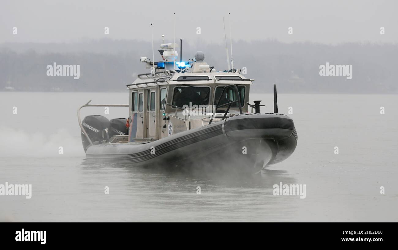 Officers with the U.S. Customs and Border Protection's Air and Marine Office patrol the waters near the U.S. Capitol several days prior to the inauguration of the 45th President, Donald J. Trump, January 17, 2017. Stock Photo
