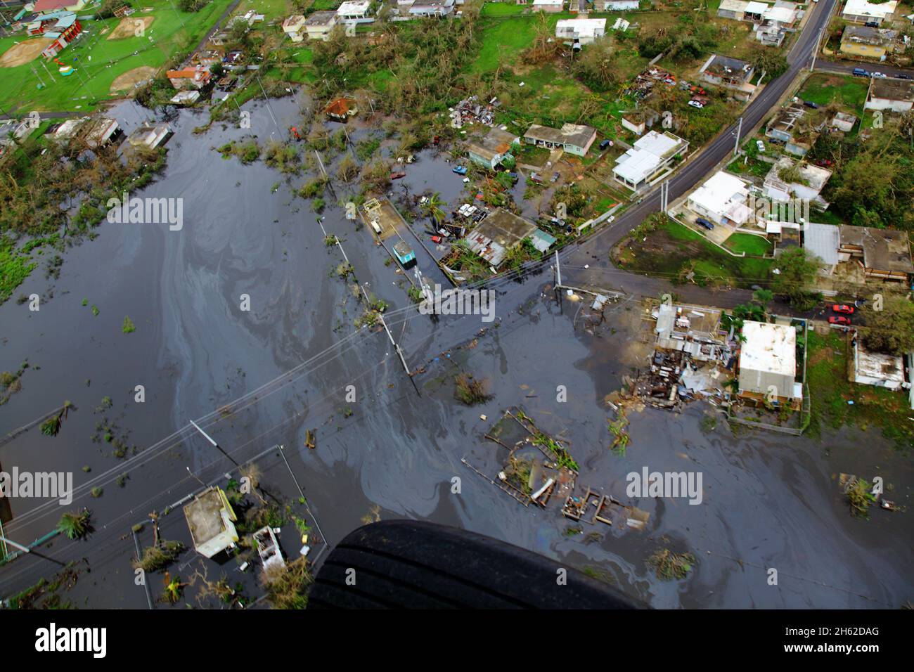Homes lay in ruin as seen from a U.S. Customs and Border Protection, Air and Marine Operations, Black Hawk during a flyover of Puerto Rico after Hurricane Maria September 23, 2017. Stock Photo