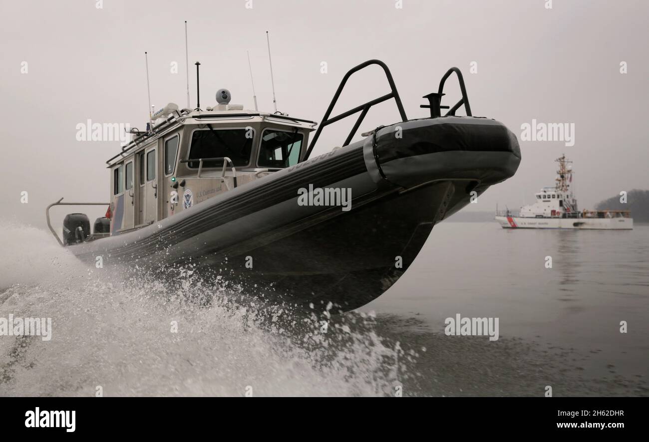 Officers with the U.S. Customs and Border Protection's Air and Marine Office patrol the waters near the U.S. Capitol several days prior to the inauguration of the 45th President, Donald J. Trump, January 17, 2017. Stock Photo