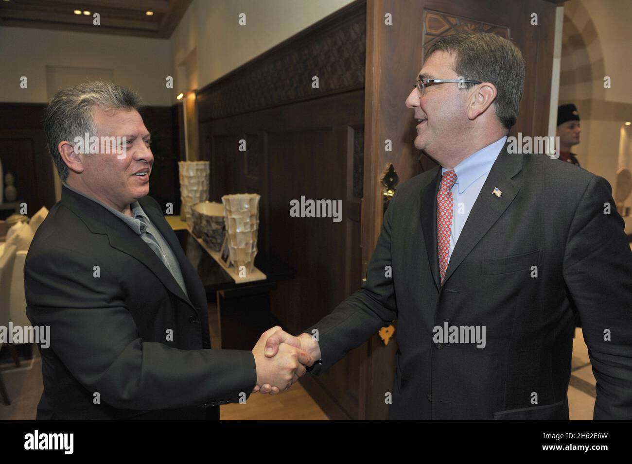 Deputy Secretary of Defense Ashton Carter is engages in a handshake with Jordan's King Abdullah II as he arrives to meet at the Royal Pallace in Amman, Jordan, Feb. 5, 2013 Stock Photo