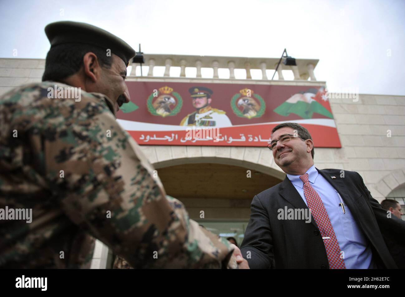 Deputy Secretary of Defense Ashton Carter shakes hands with General Hussein Al Zyoud, commander of Jordan's border guard security forces after meeting with him Amman, Jordan, Feb. 5, 2013, to discuss Jordan's border security efforts in the shadow of the ongoing civil conflict in neighboring Seria. Stock Photo