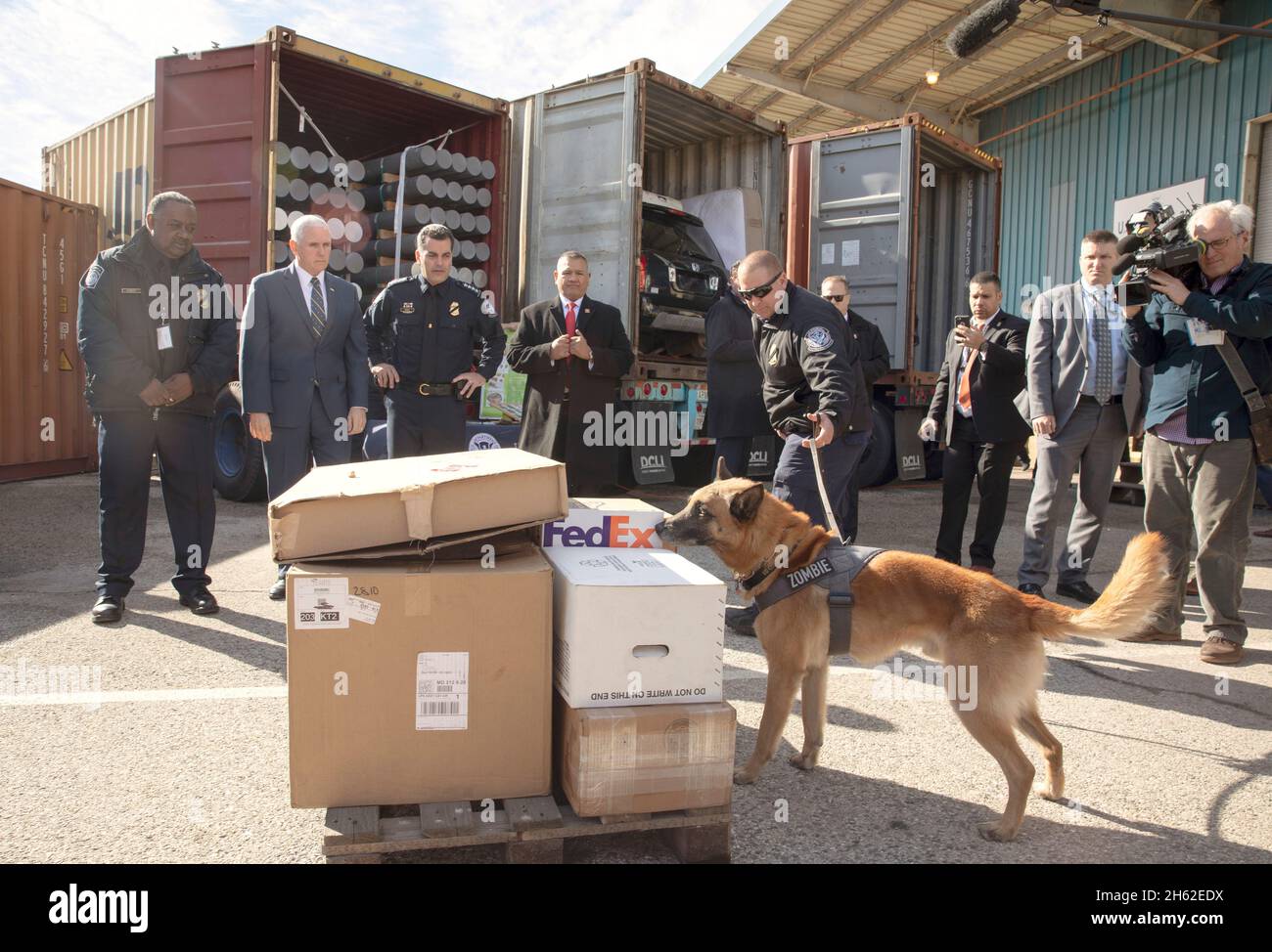 Vice President of the United States Mike Pence is given a demonstration of canine search procedures by U.S. Customs and Border Protection Officer Robert Unitis and his dog 'Zombie,' 7, as he visits U.S. Customs and Border Protection operations at Dundalk Marine Terminal within the Port of Baltimore in Baltimore, Md., February 8, 2019. Stock Photo