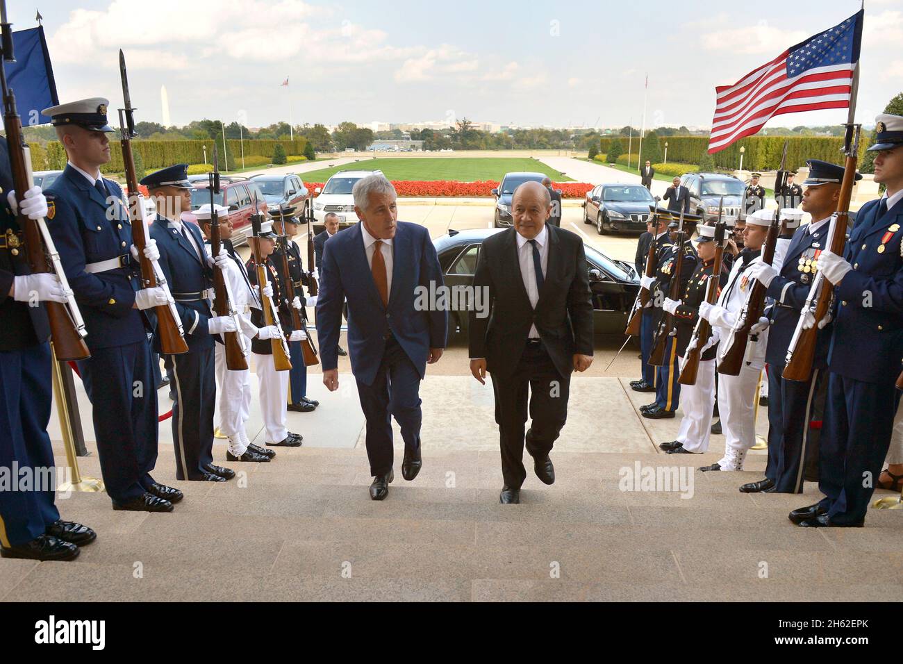 Secretary of Defense Chuck Hagel hosts an honor cordon to welcome France's Minister of Defense Jean-Yves Le Drian for a meeting at the Pentagon, October 2, 2014. Stock Photo