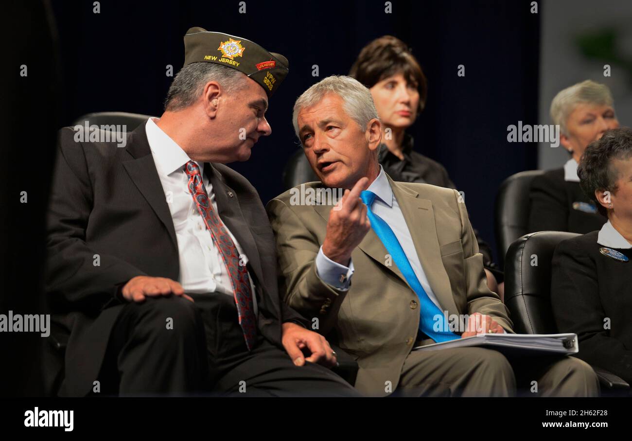 Secretary of Defense Chuck Hagel speaks with Veterans of Foreign Wars Assistant Adjunct General Robert Wallace July 22, 2013. Stock Photo