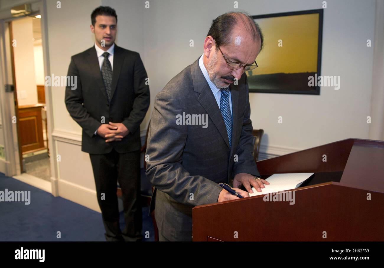 Enayatullah Nazari, the First Deputy Defense Minister of Afghanistan, signs the guest book at the Pentagon before a meeting with Deputy Secretary of Defense Ashton B. Carter June 8, 2012. Stock Photo