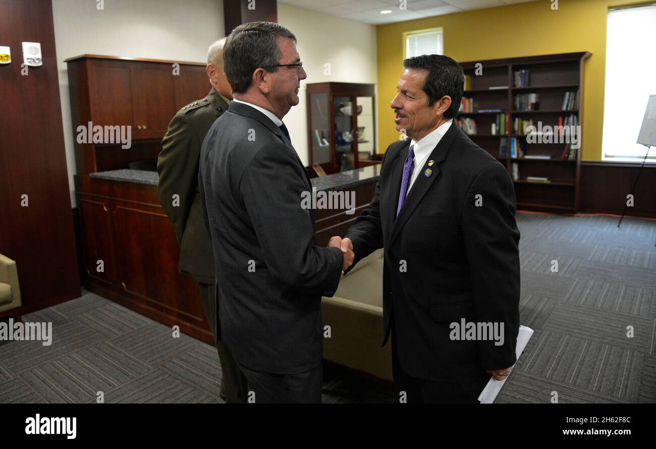 Deputy Secretary of Defense Ash Carter, exchanges greetings with Miami-Dade County Commissioner Jose 'Pepe' Diaz  June 4, 2013. Stock Photo