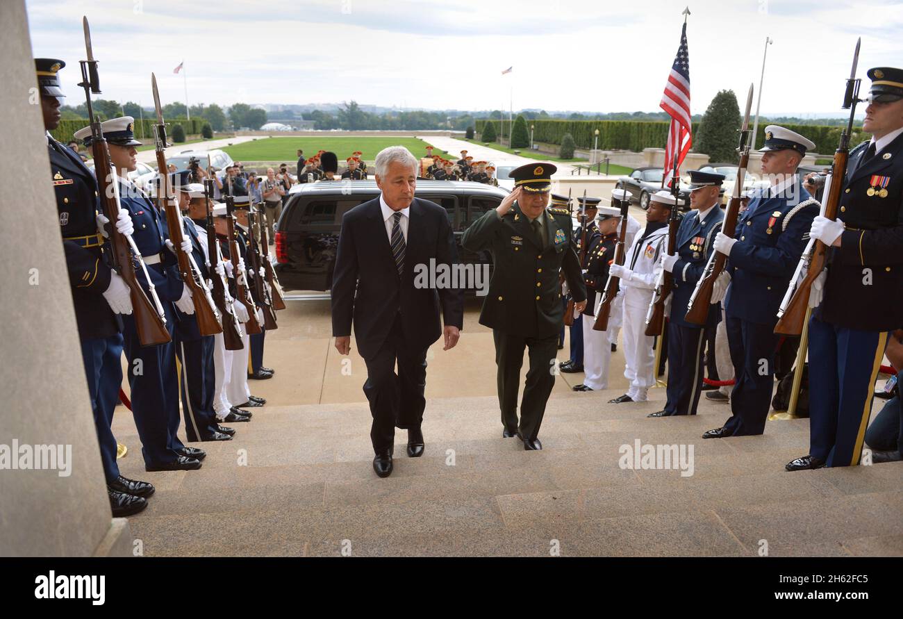 U.S. Secretary of Defense Chuck Hagel, center left, hosts an honor cordon to welcome China's Minister of National Defense General Chang Wanquan ca. 2013 Stock Photo