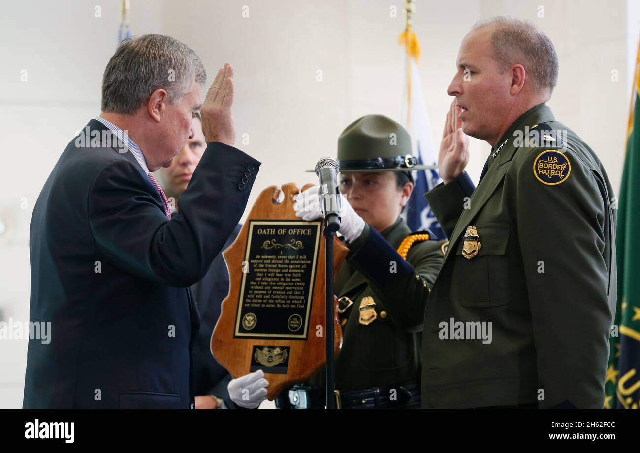 U.S. Customs and Border Protection Commissioner R. Gil Kerlikowske swears-in newly appointed Chief of U.S. Border Patrol Mark Morgan during a ceremony at the Ronald Reagan Building in Washington, D.C., October 11, 2016. Stock Photo