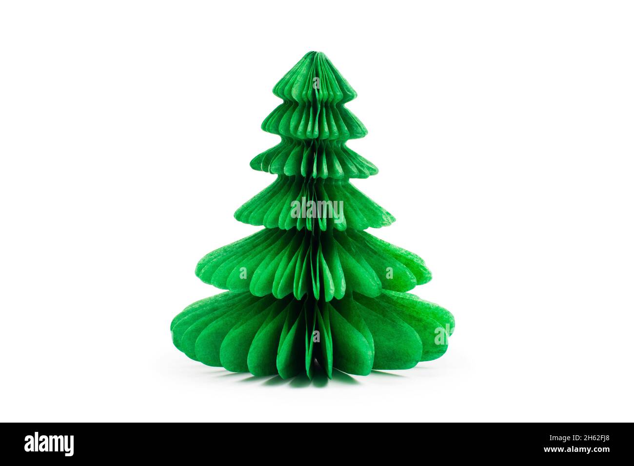 Handmade Christmas tree cut out from green paper on white background Stock Photo