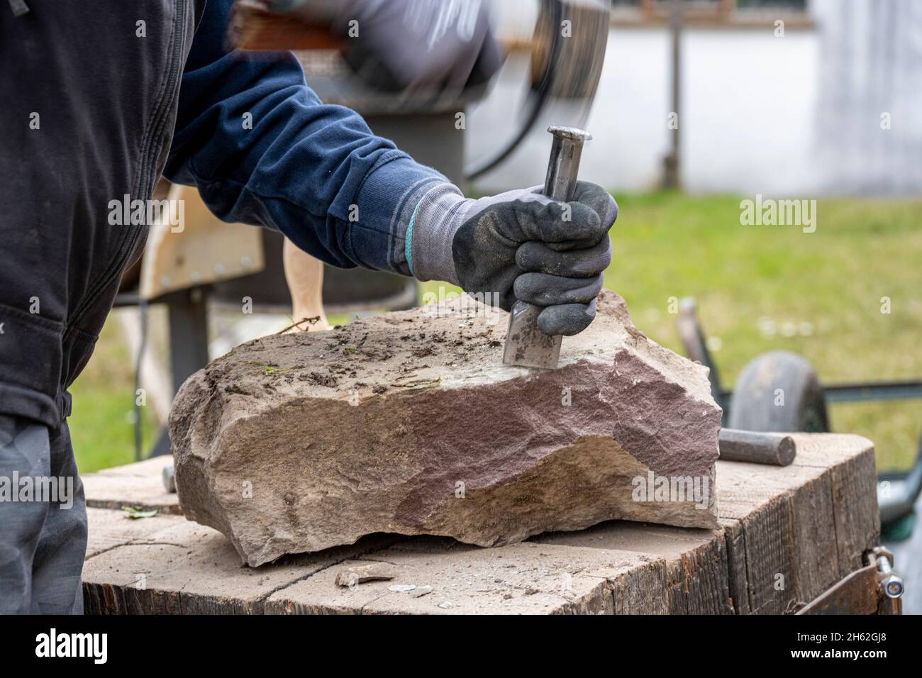 sandstone is being processed for a dry stone wall. Stock Photo