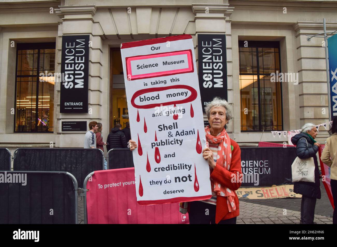 London, UK. 12th Nov, 2021. A protester holds a placard expressing her opinion during the demonstration.Extinction Rebellion demonstrators gathered outside the Science Museum in South Kensington, as part of their ongoing protests against sponsorship of the museum by fossil fuel companies Shell and Adani. Credit: SOPA Images Limited/Alamy Live News Stock Photo